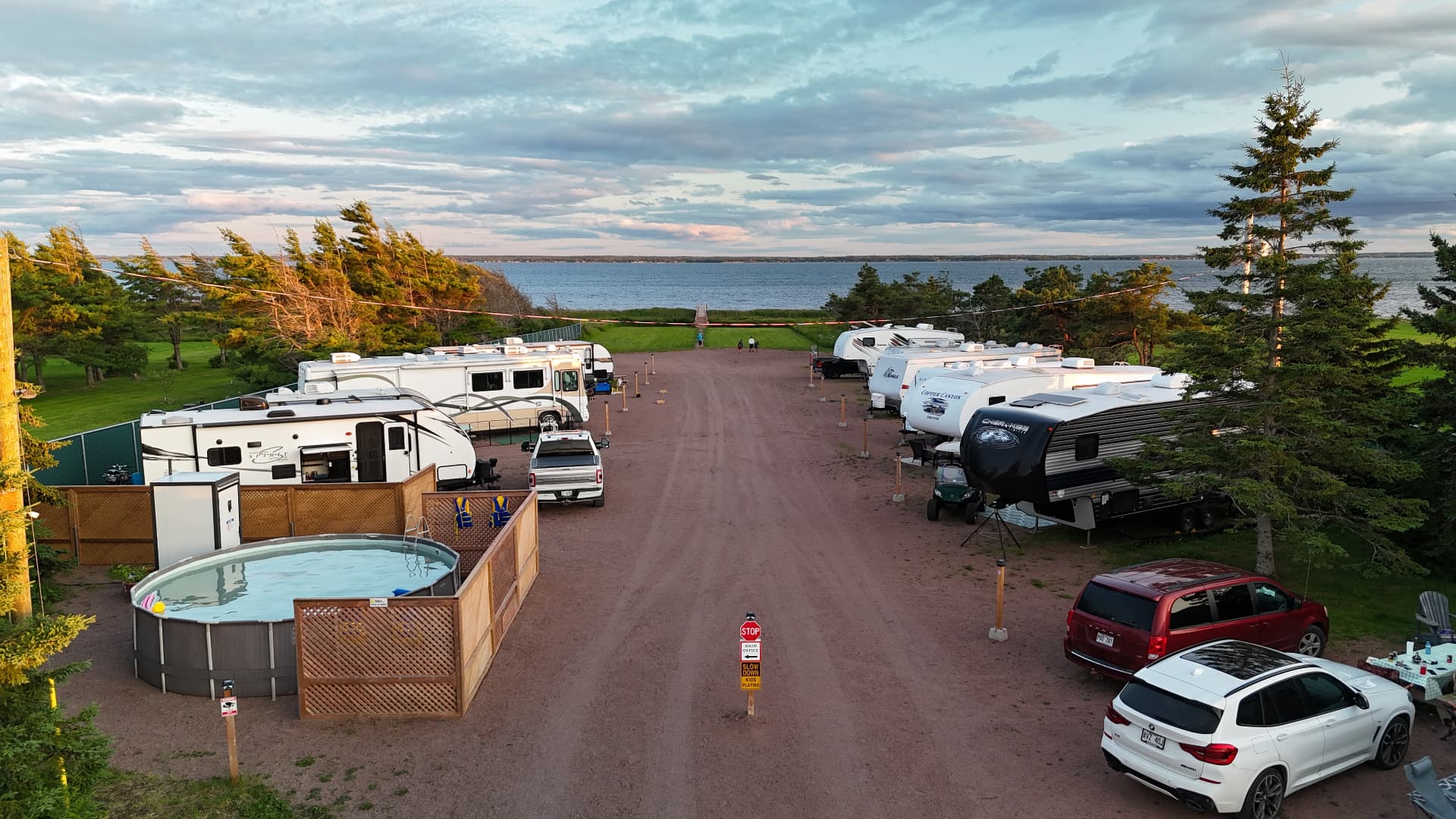 Aerial view of Hunter Beach Campground with RV sites, pool and the bay