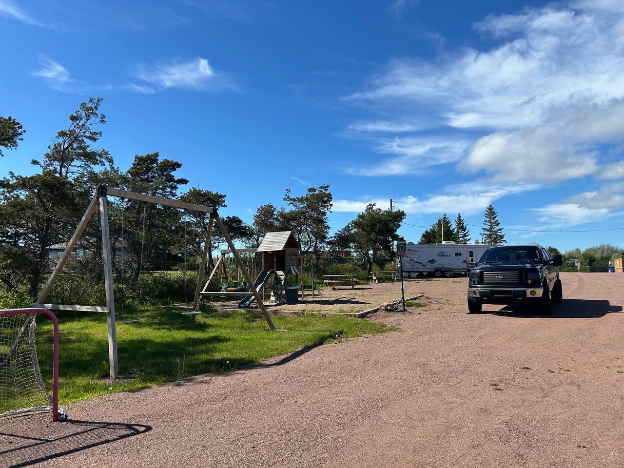 Playground and truck parked near the RV sites